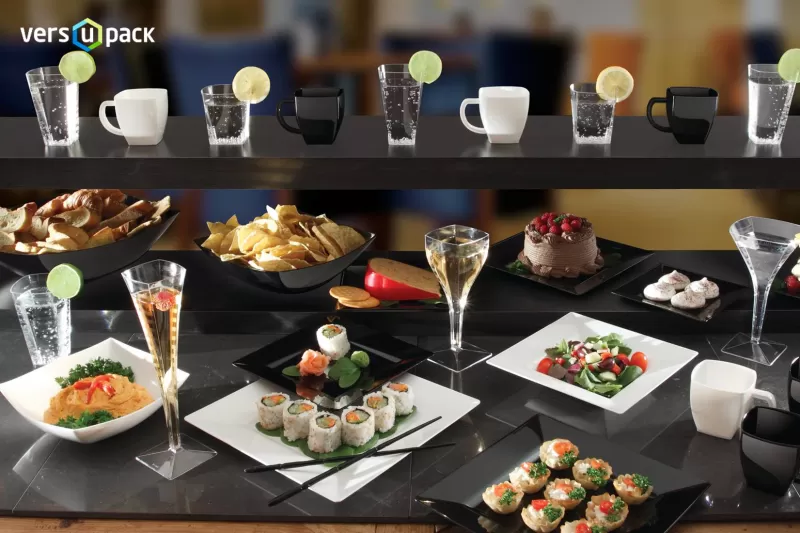 Catering disposables: wine glasses, champagne flutes, cutlery, plates and bowls.